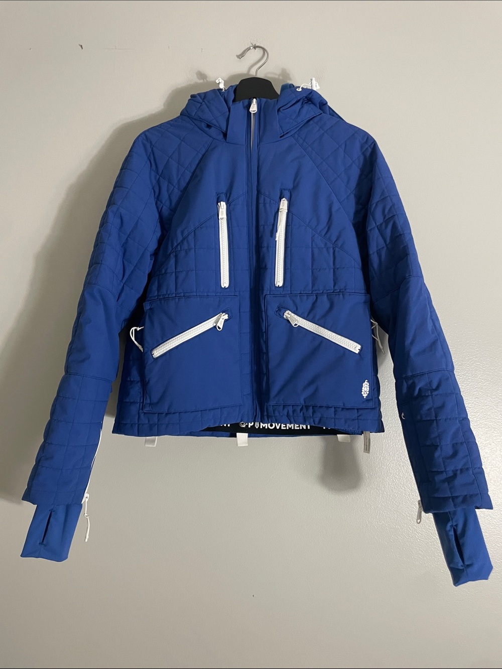 Blue Quilted Hooded Women's Jacket with White Zippers